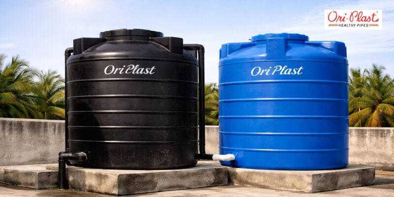 A side-by-side view of a black and a blue Ori-Plast water tank installed outdoors. The image demonstrates robust construction and professional piping, ideal for users looking for long-lasting water storage that stays efficient in sunny conditions.