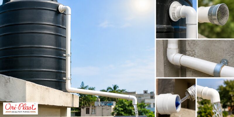 A white PVC overflow pipe setup attached to a black water tank showing proper slope and drainage as part of water tank overflow causes and fixes.